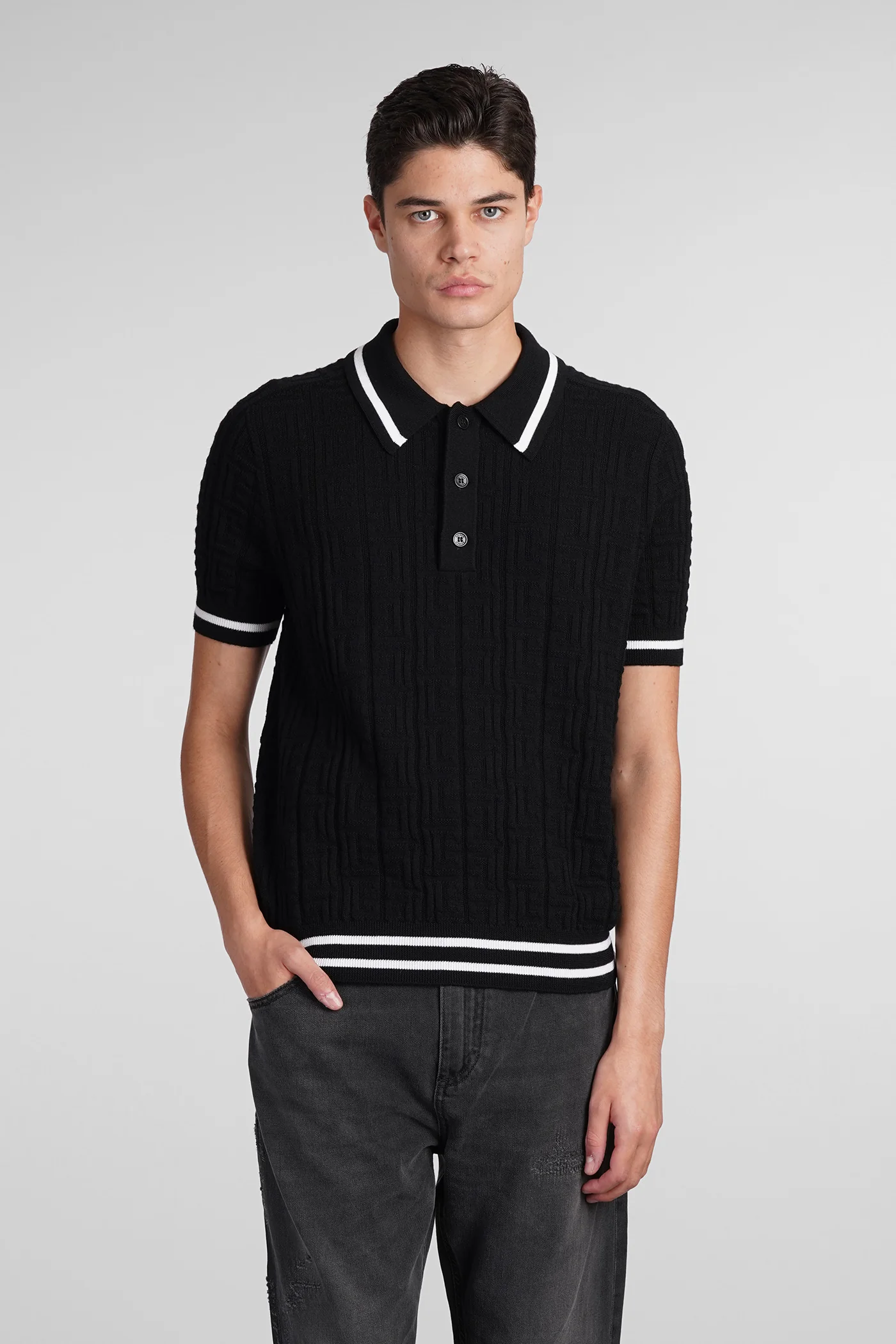 Polo in black wool
