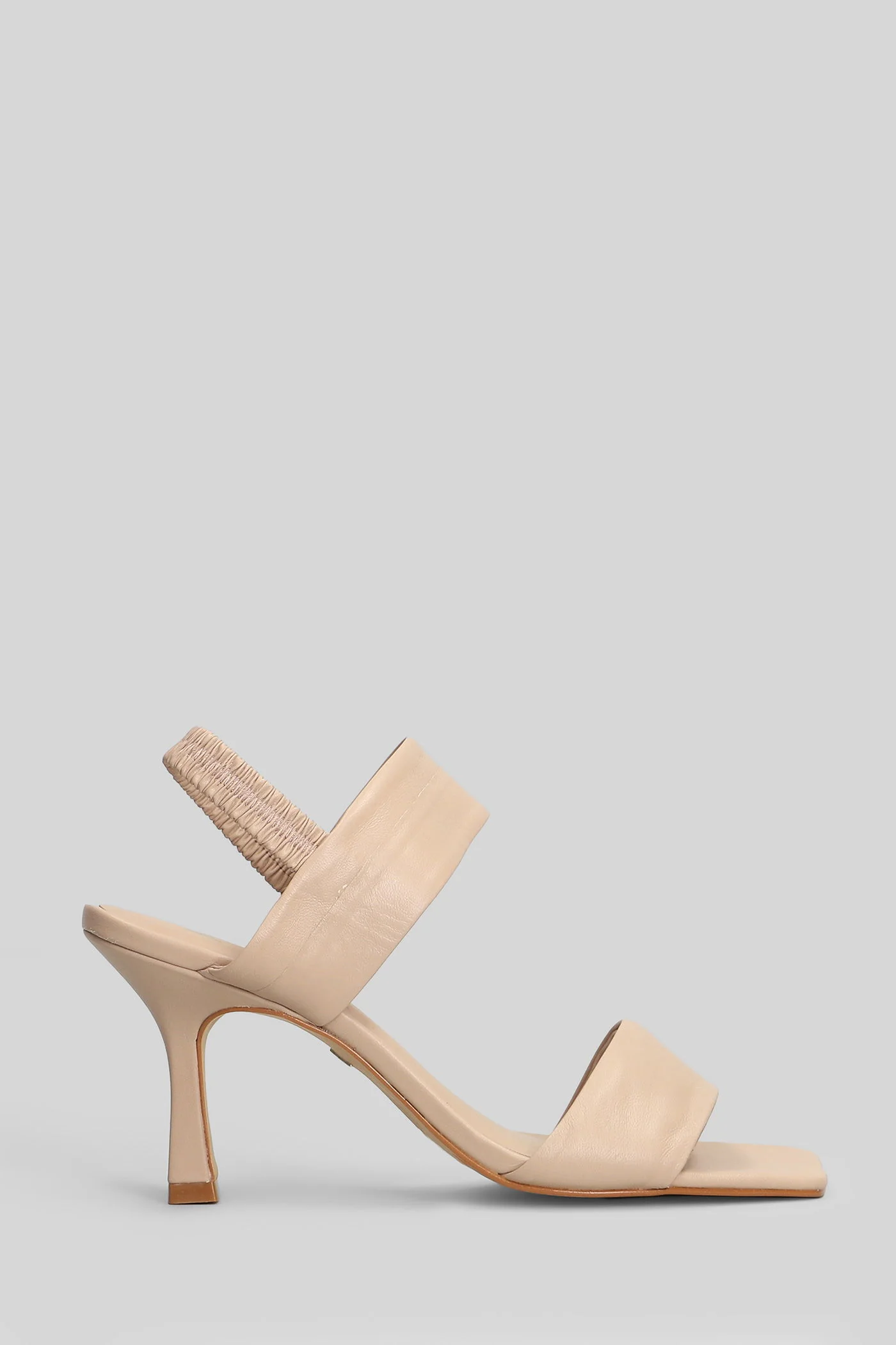 Sandals in beige leather