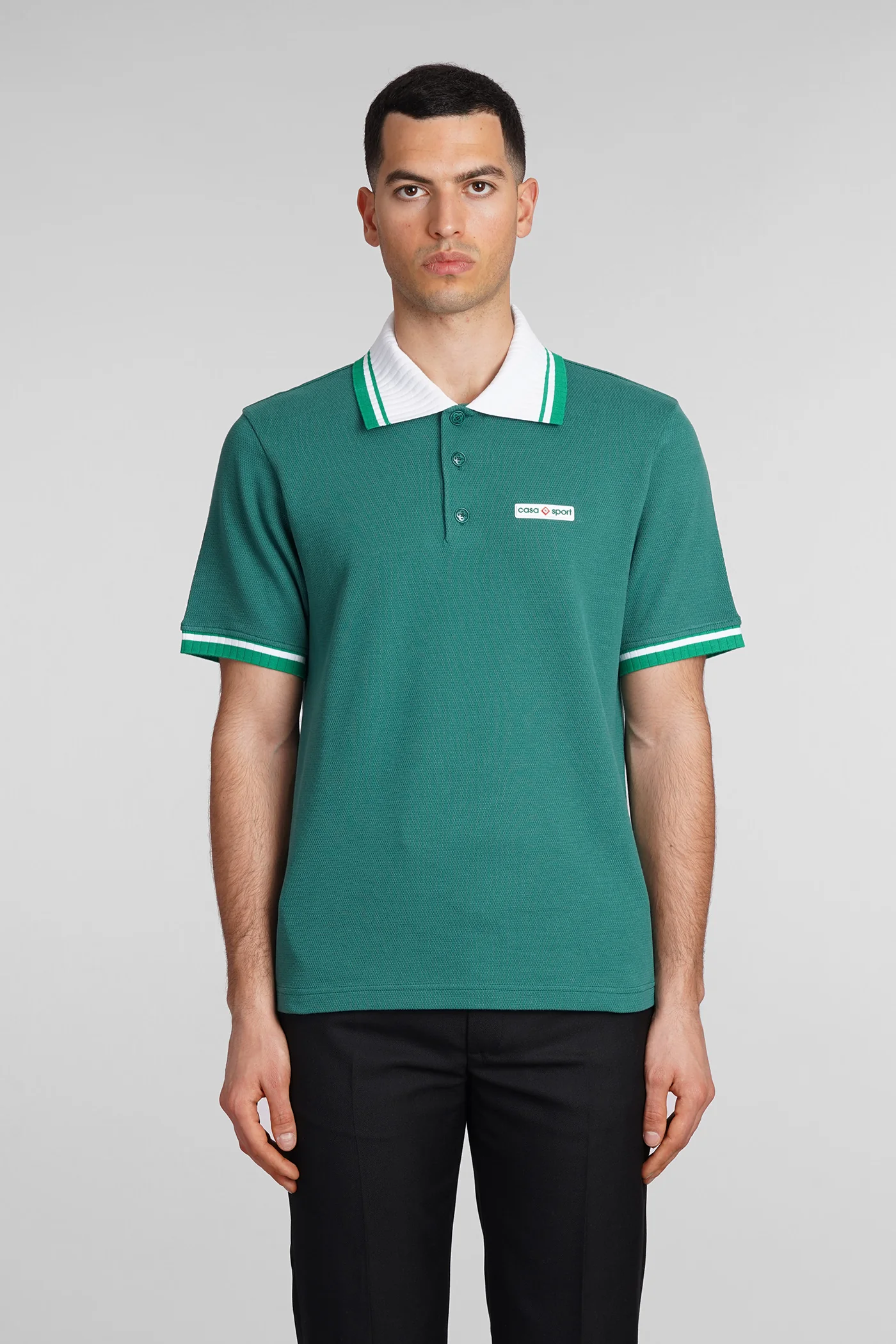 Polo in green cotton