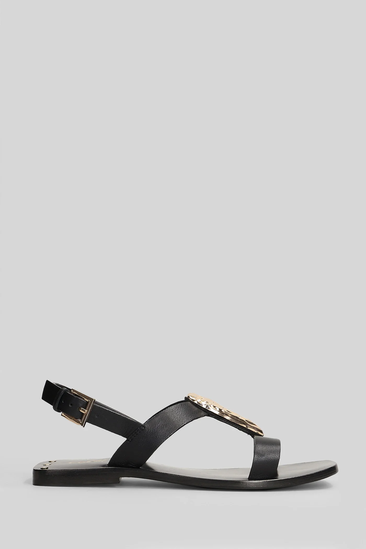 Flat sandal-slipper in black leather