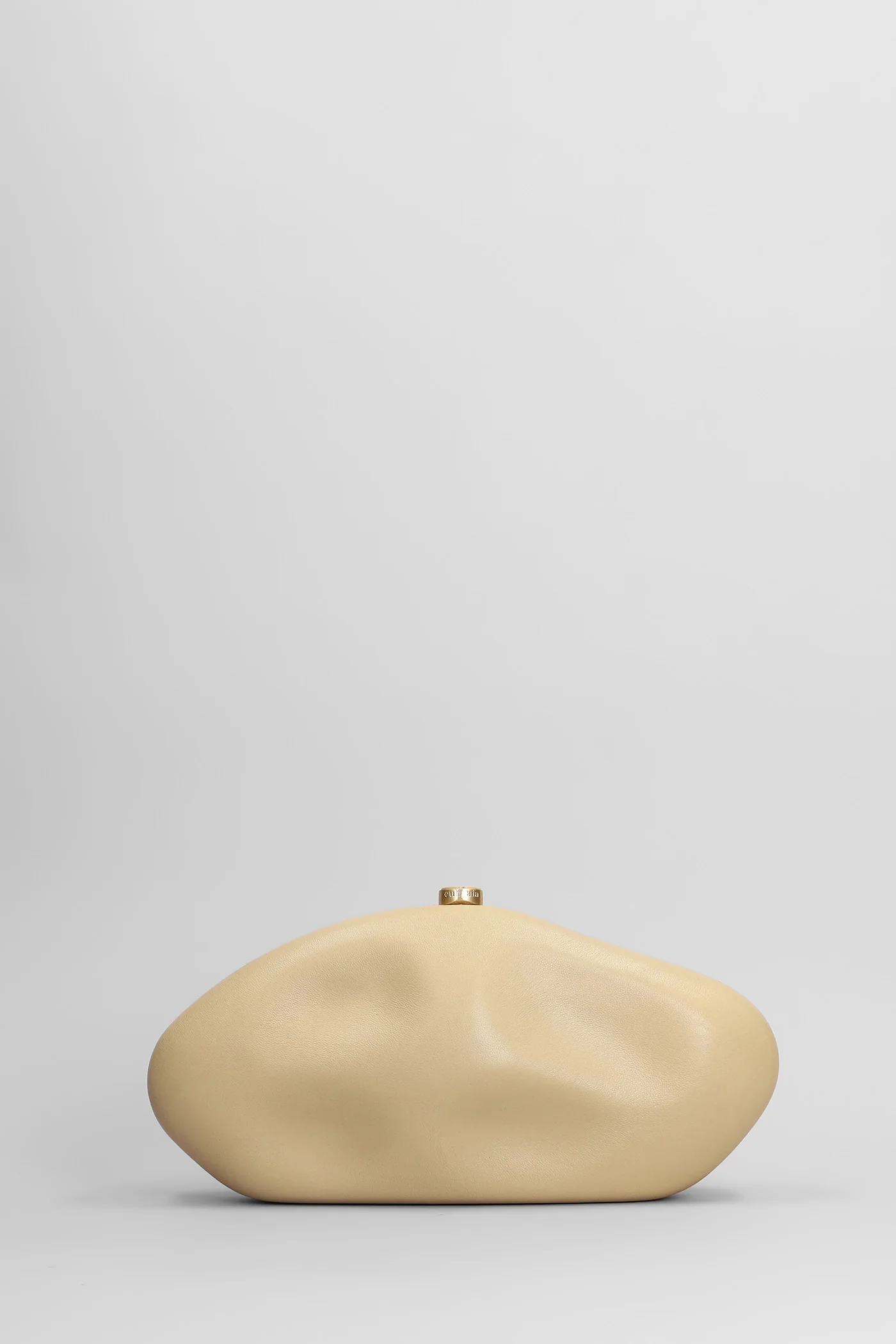 The caldera Clutch in beige leather