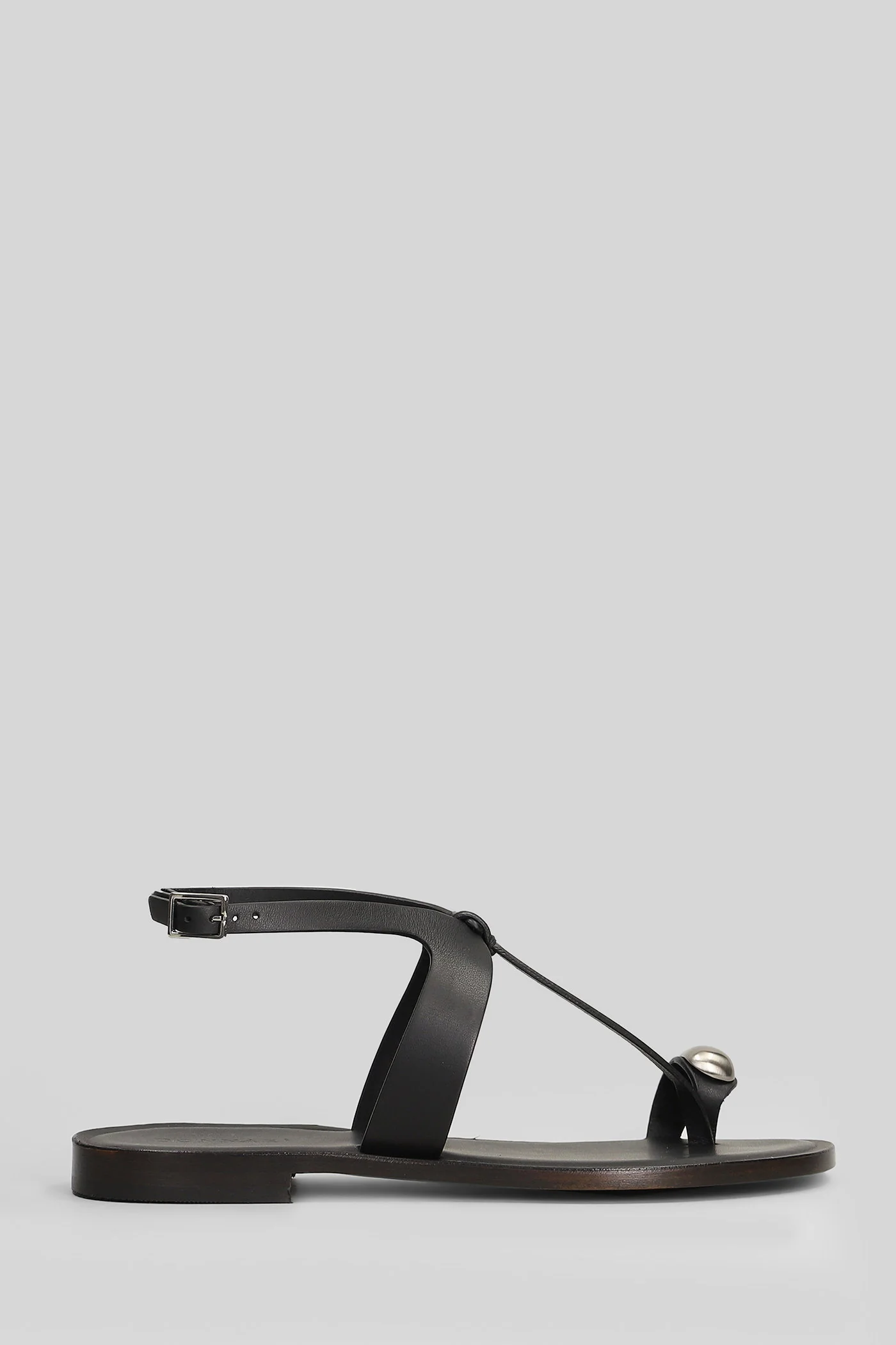 Flat sandal-slipper in black leather and fabric