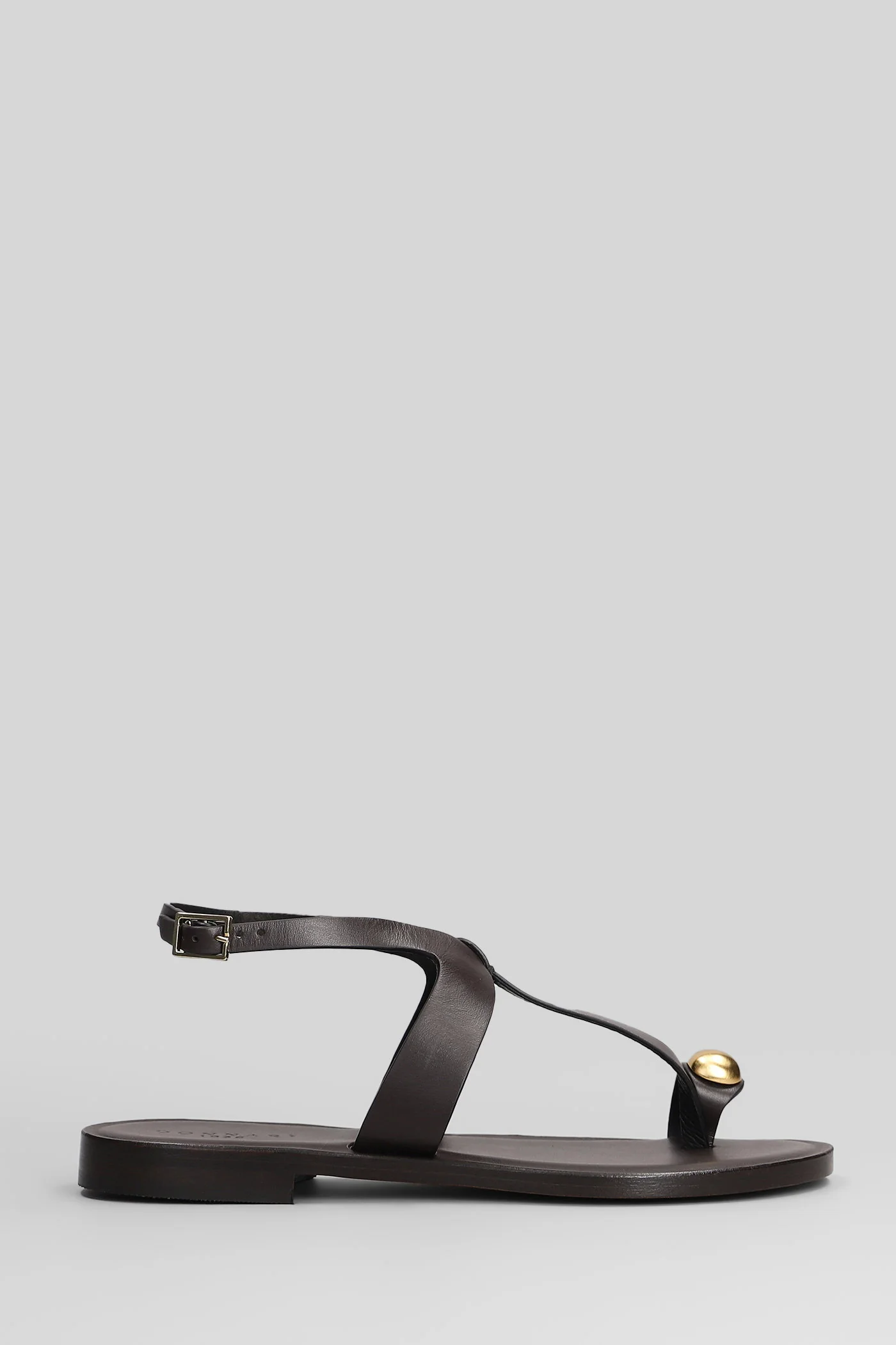 Flat sandal-slipper in brown leather and fabric
