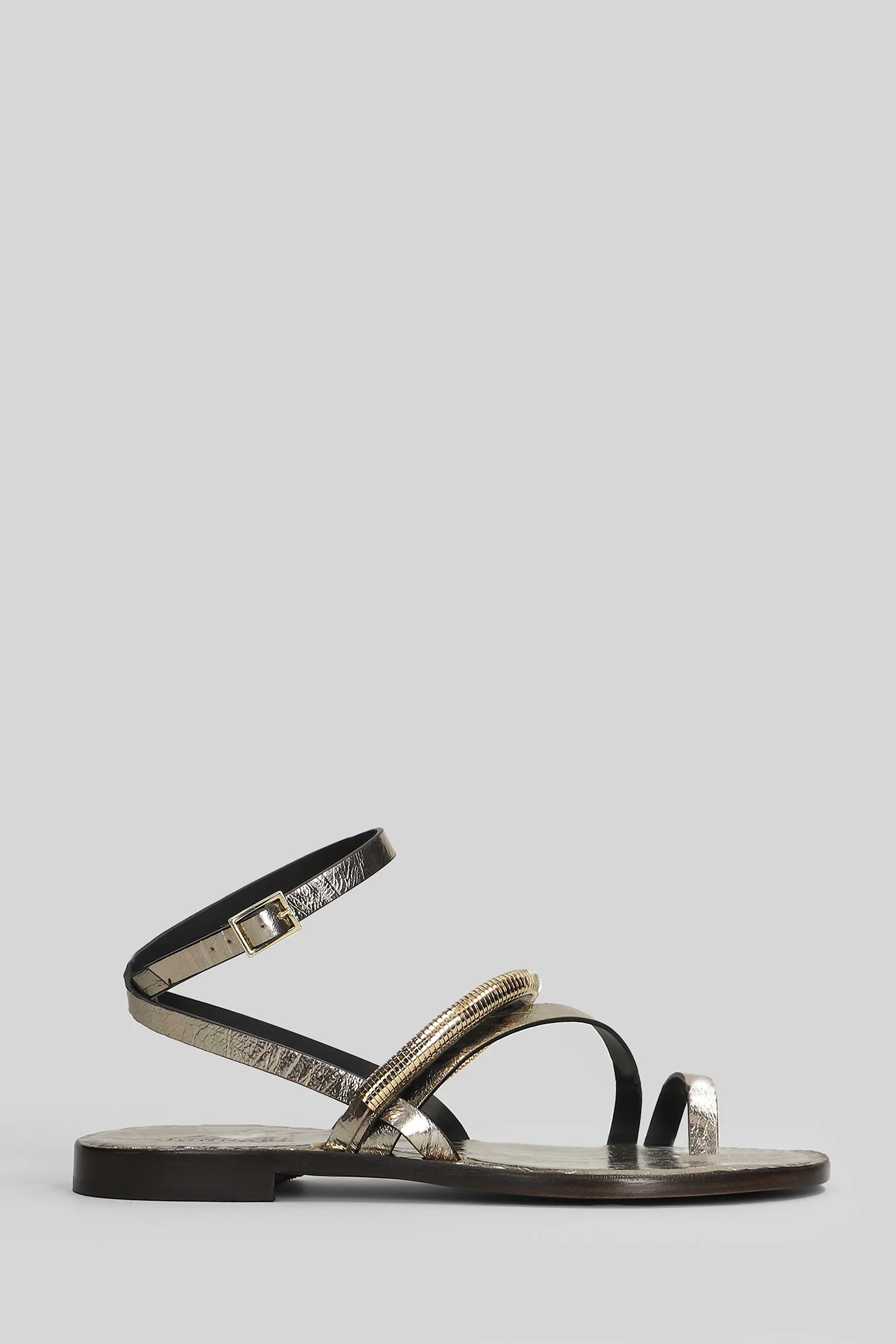 Flat sandal-slipper in platinum leather