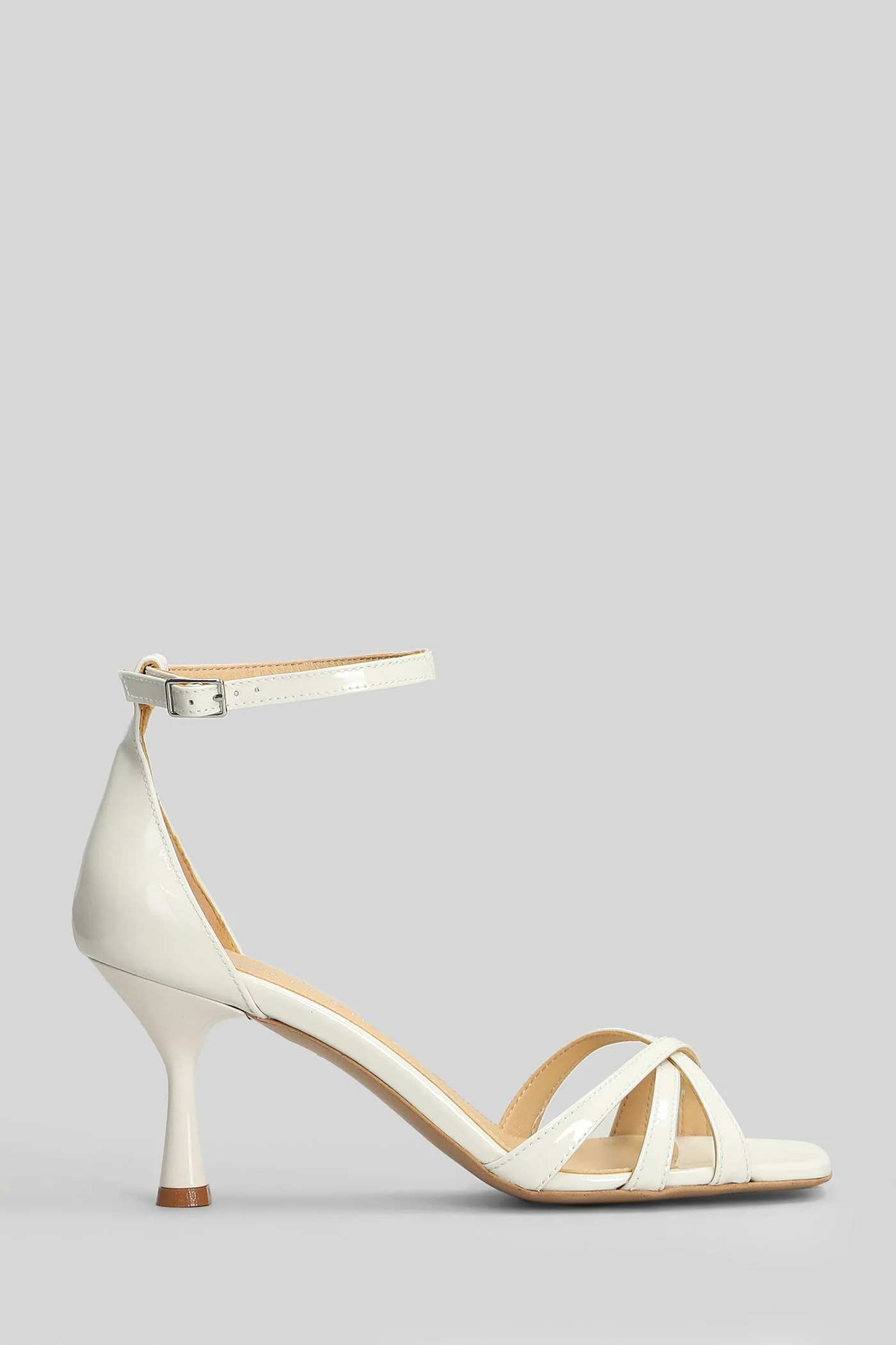 Sandals in white patent leather