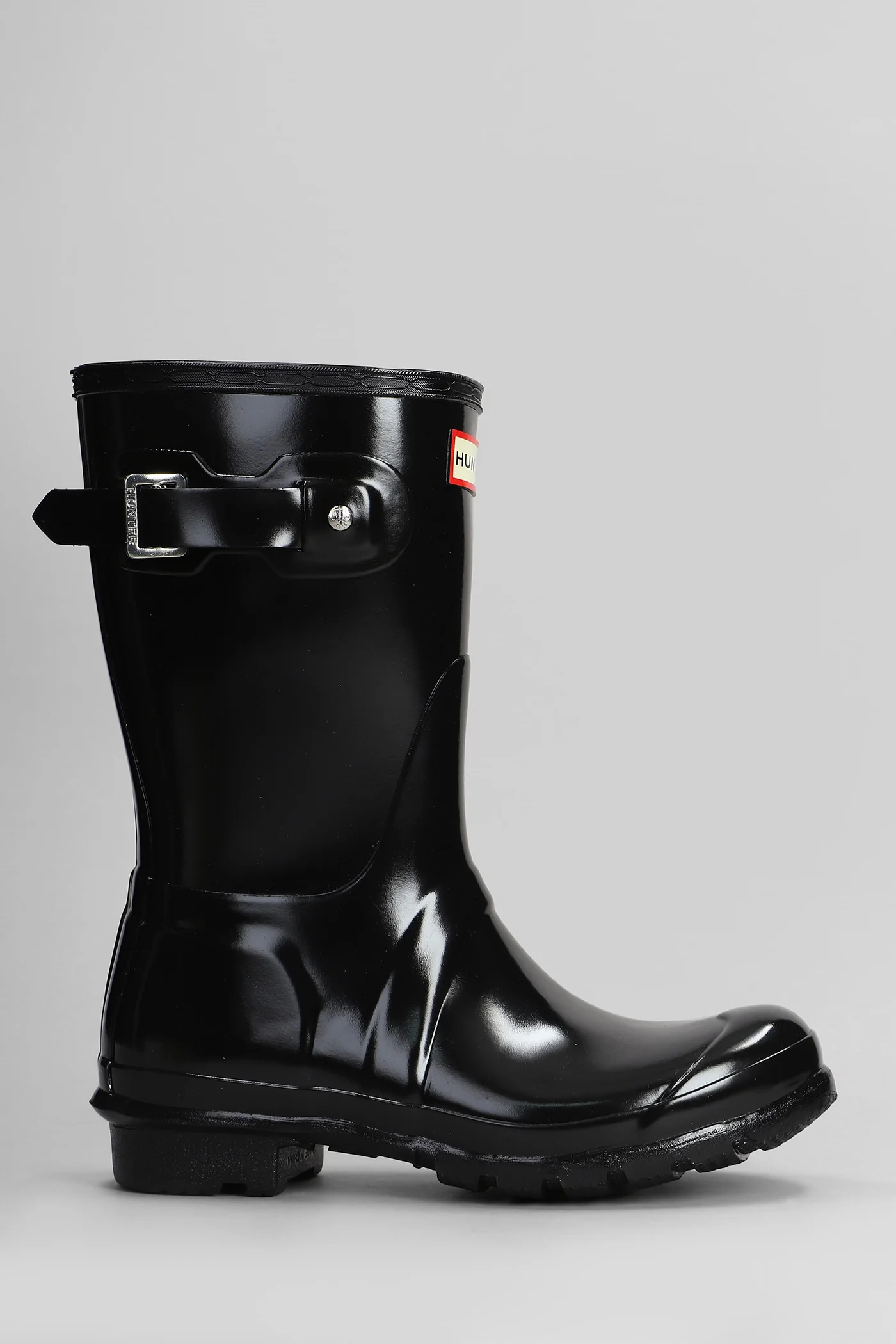 Original short gloss low heels boots in black rubber/plasic