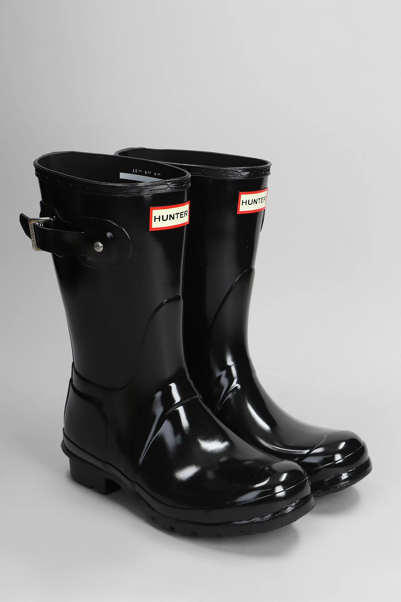 Original short gloss low heels boots in black rubber/plasic - Image 2