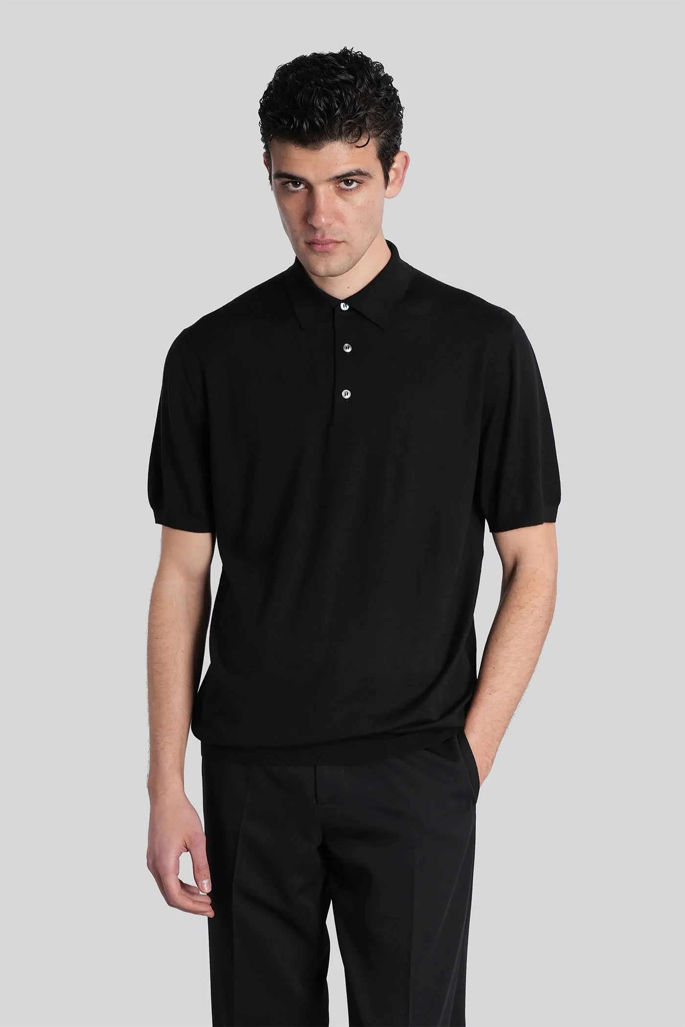 Polo in black wool