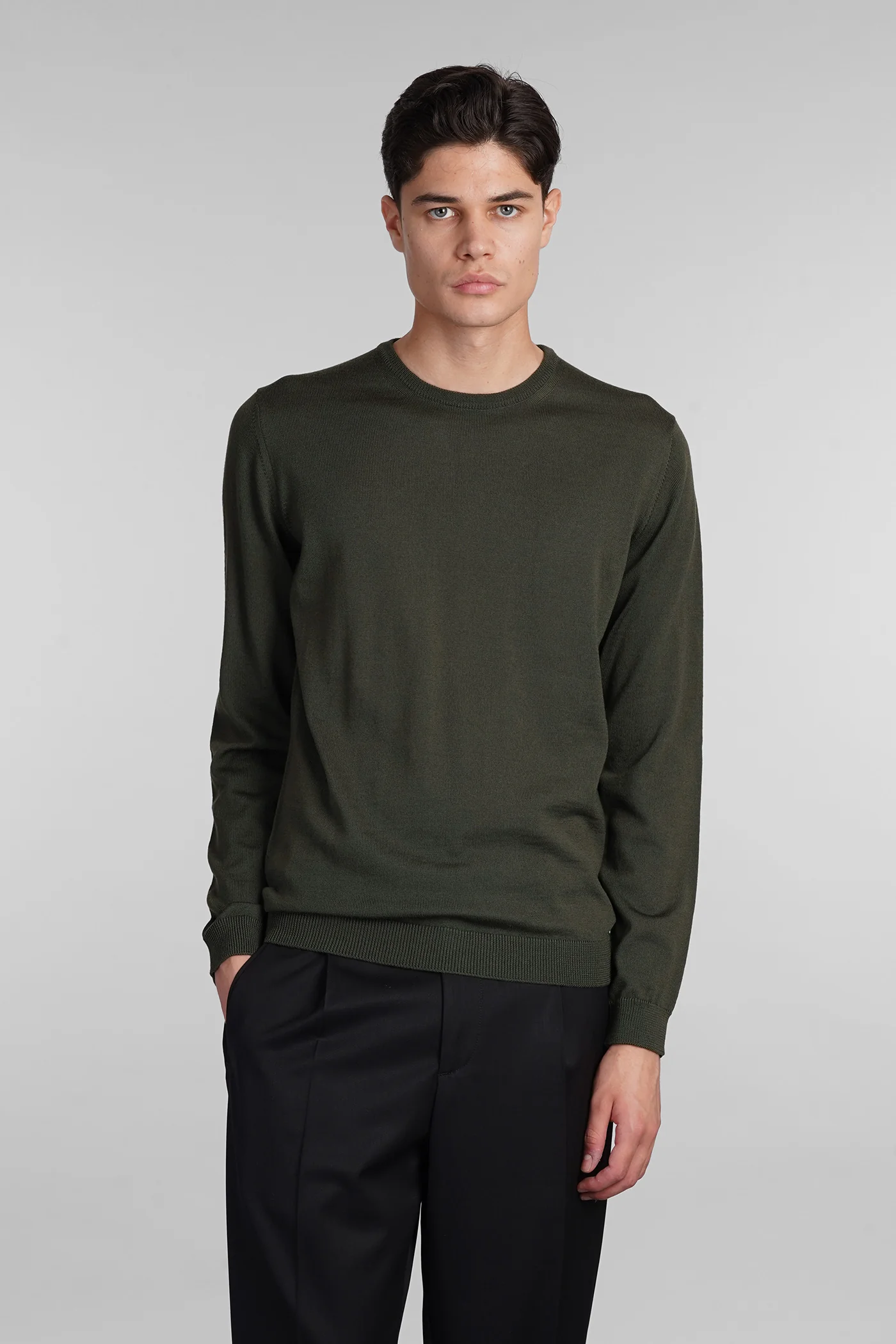 Knitwear in green wool