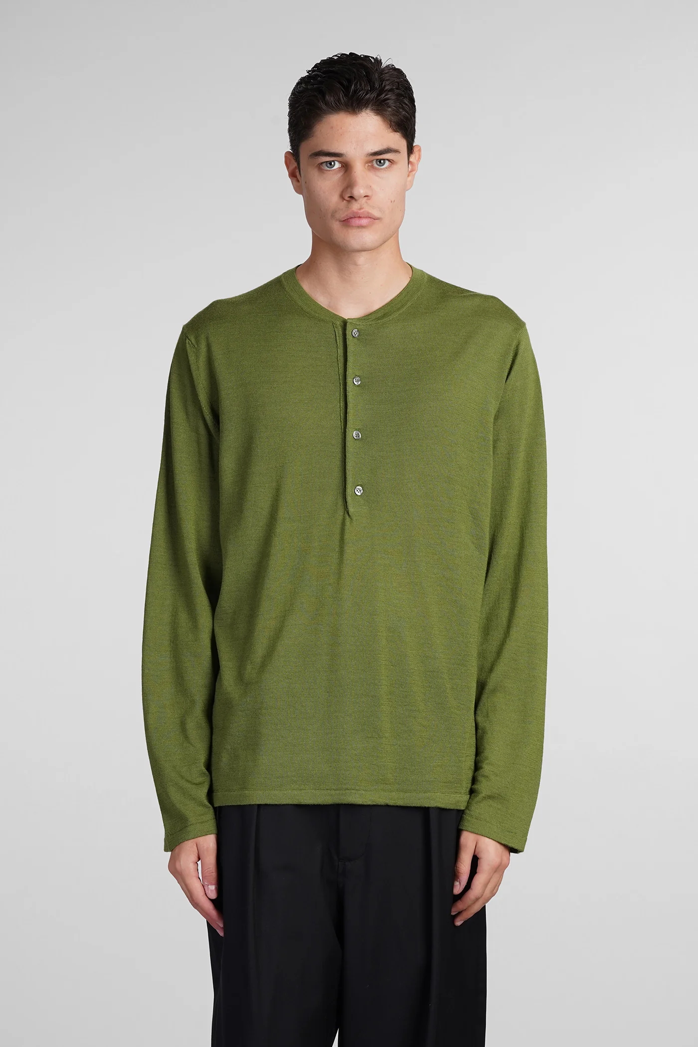 Knitwear in green wool