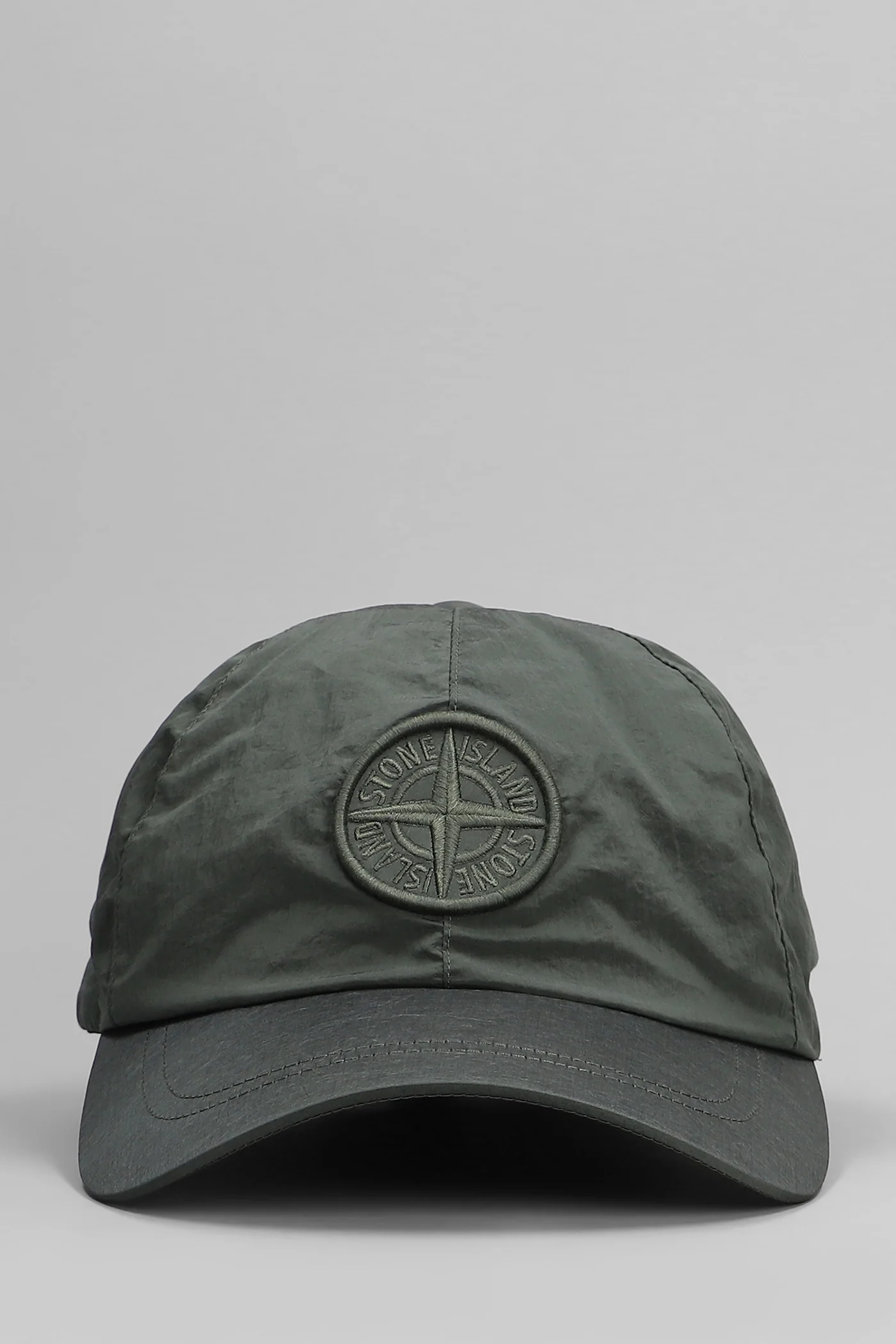 Hats in green polyamide