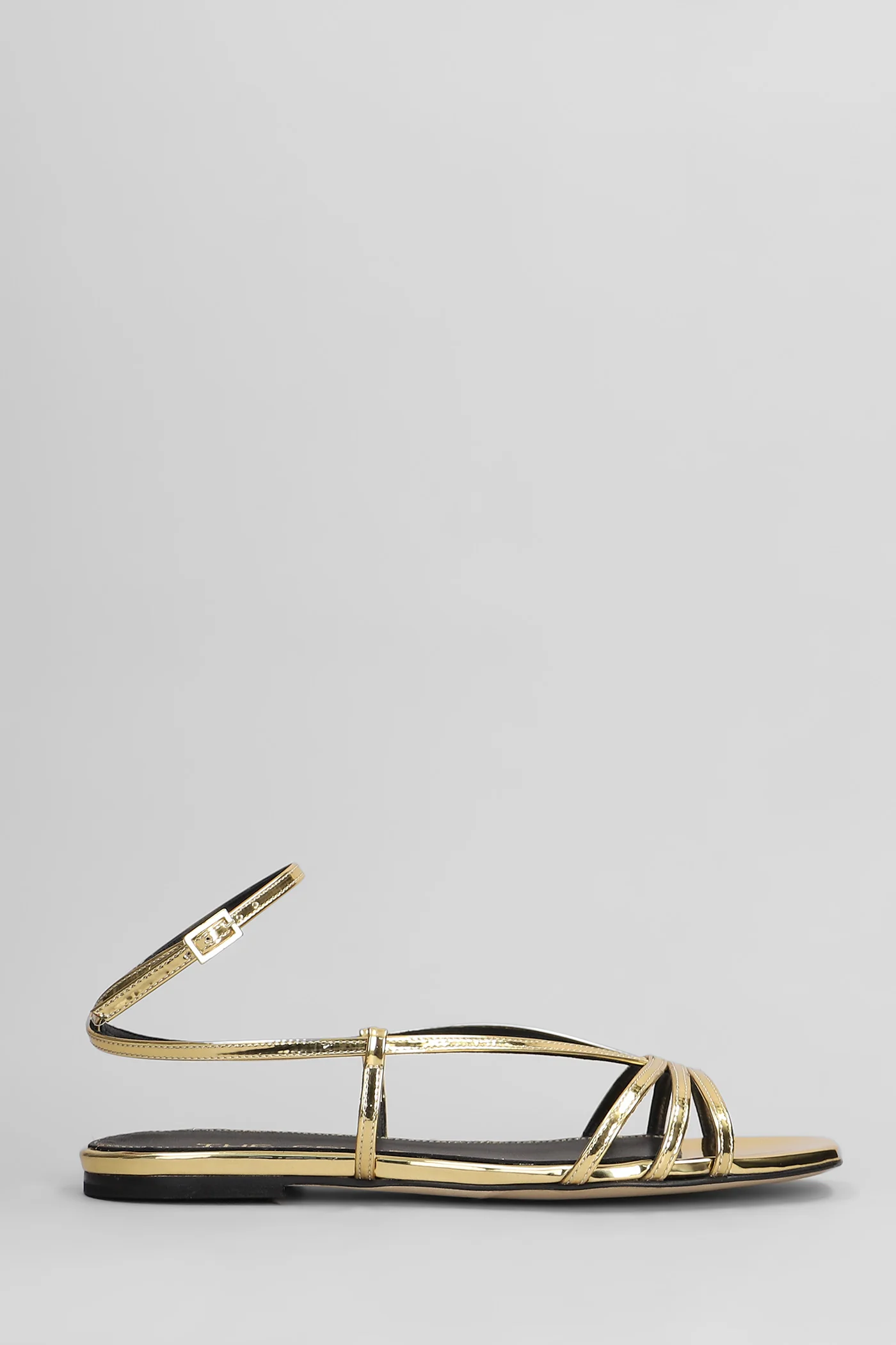Flats in gold leather