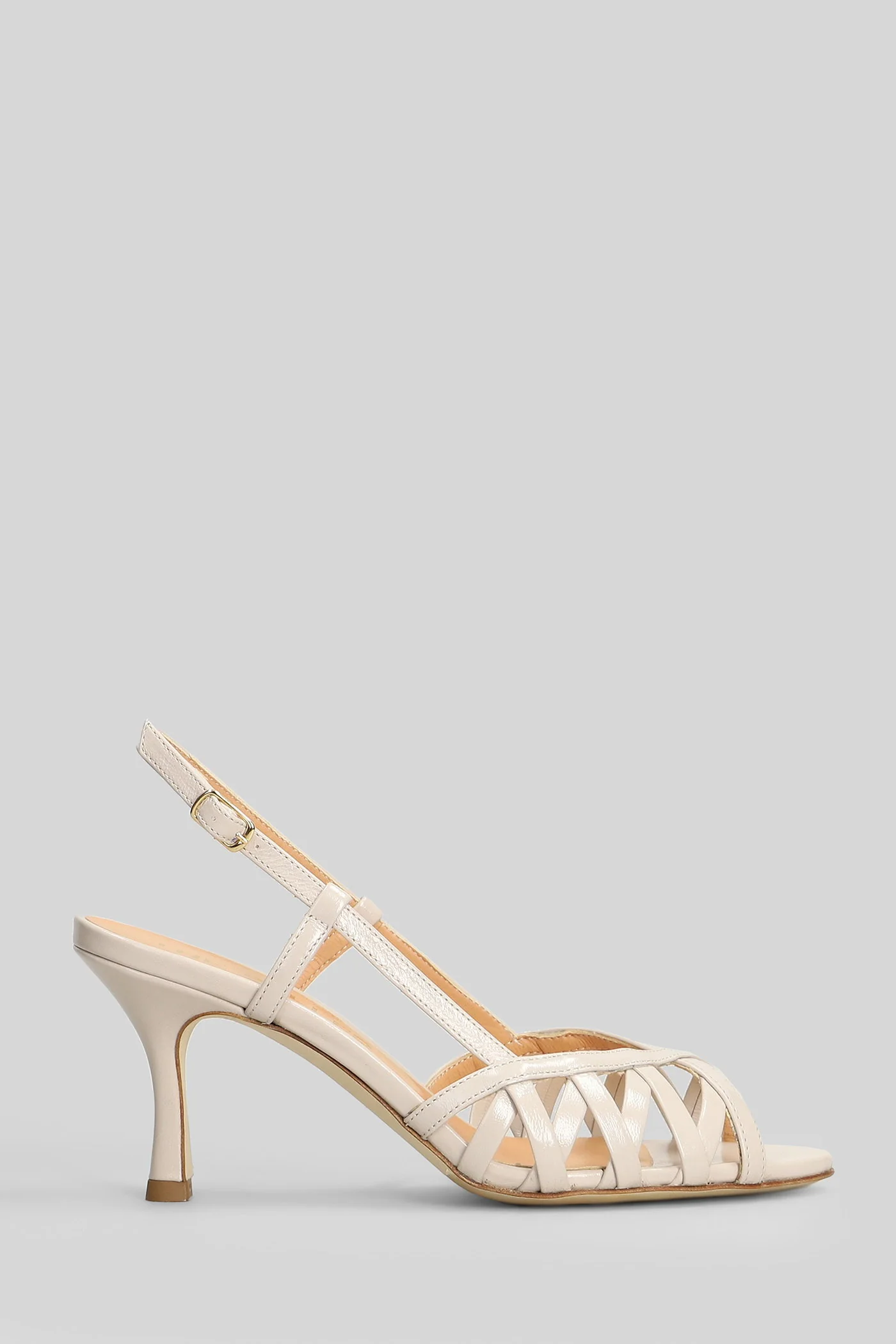 Sandals in beige leather