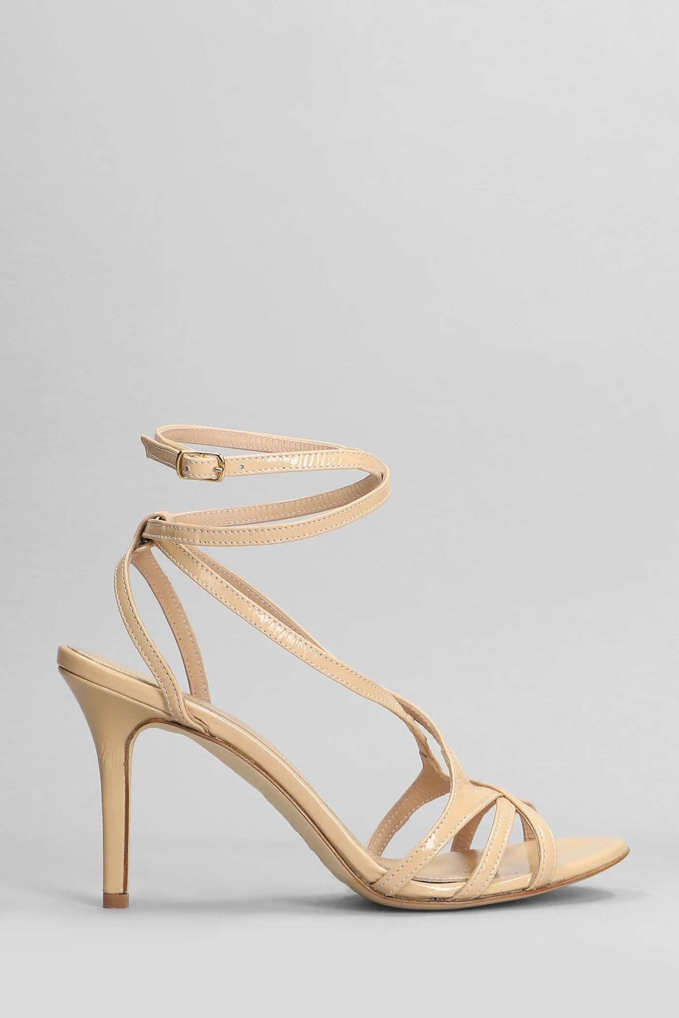 Sandals in beige leather