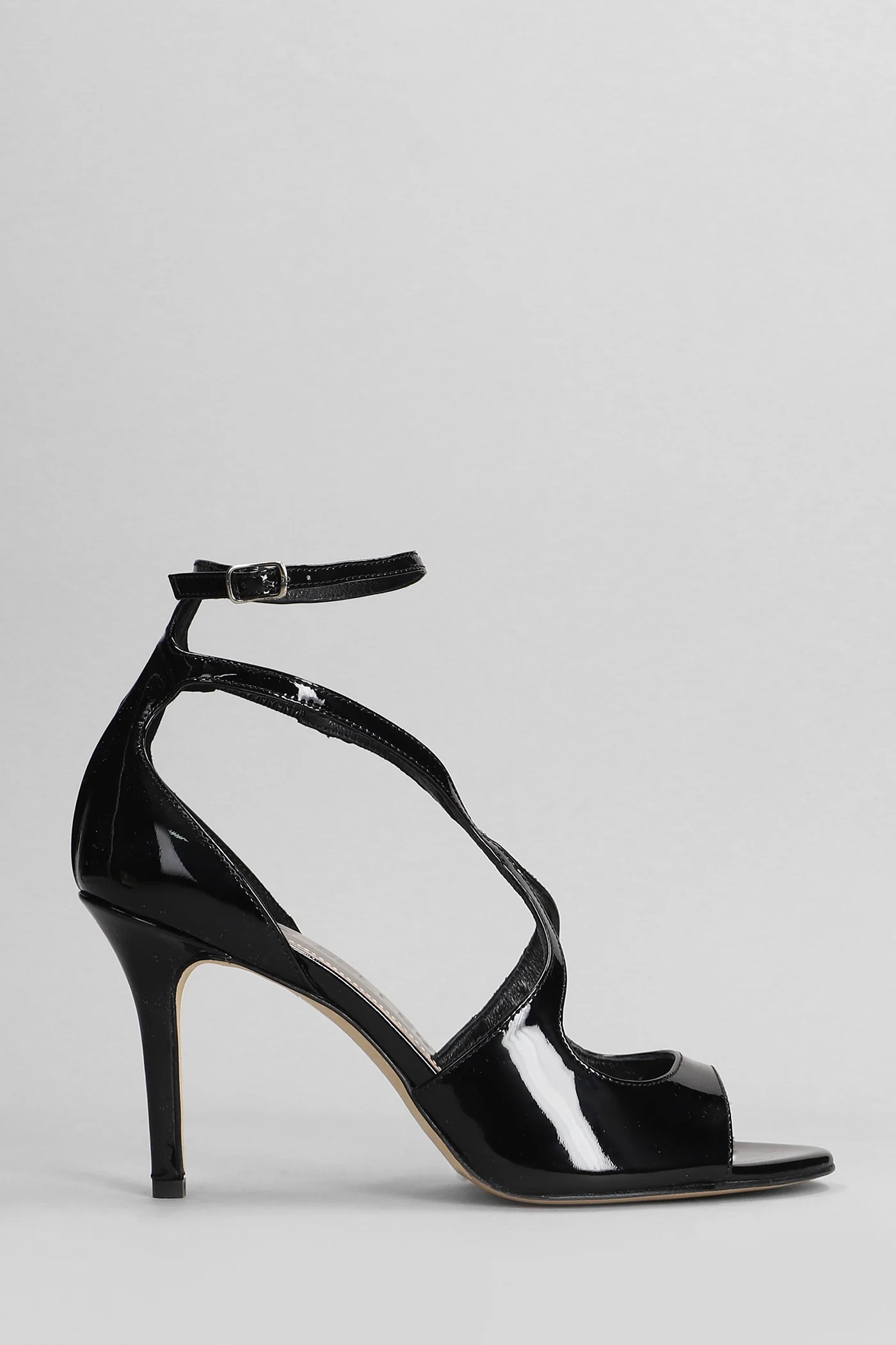 Sandals in black patent leather