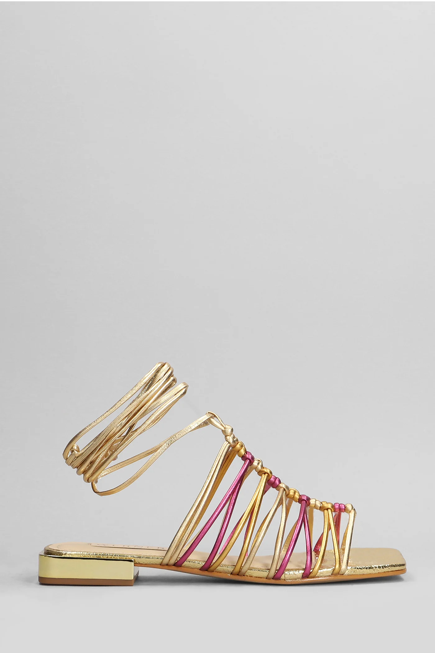 Flats in gold leather
