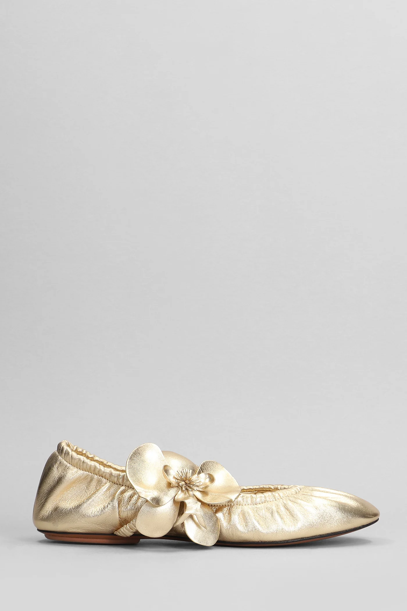 Ballet flats in gold leather